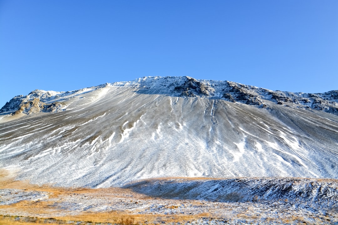 snow covered mountain under blue sky during daytime