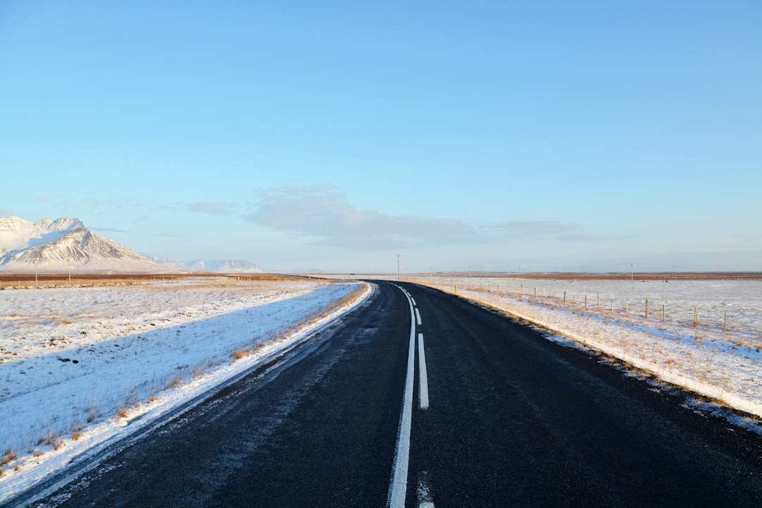 black asphalt road under blue sky during daytime