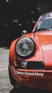 orange car with black and white light
