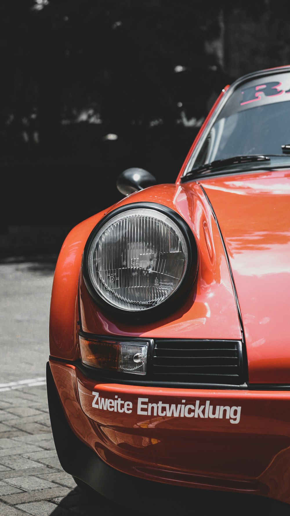 orange car with black and white light