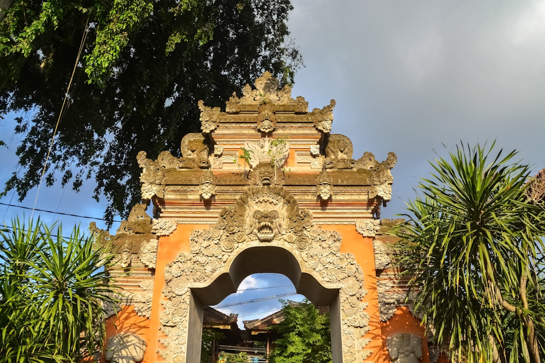 brown concrete arch with arch shaped window