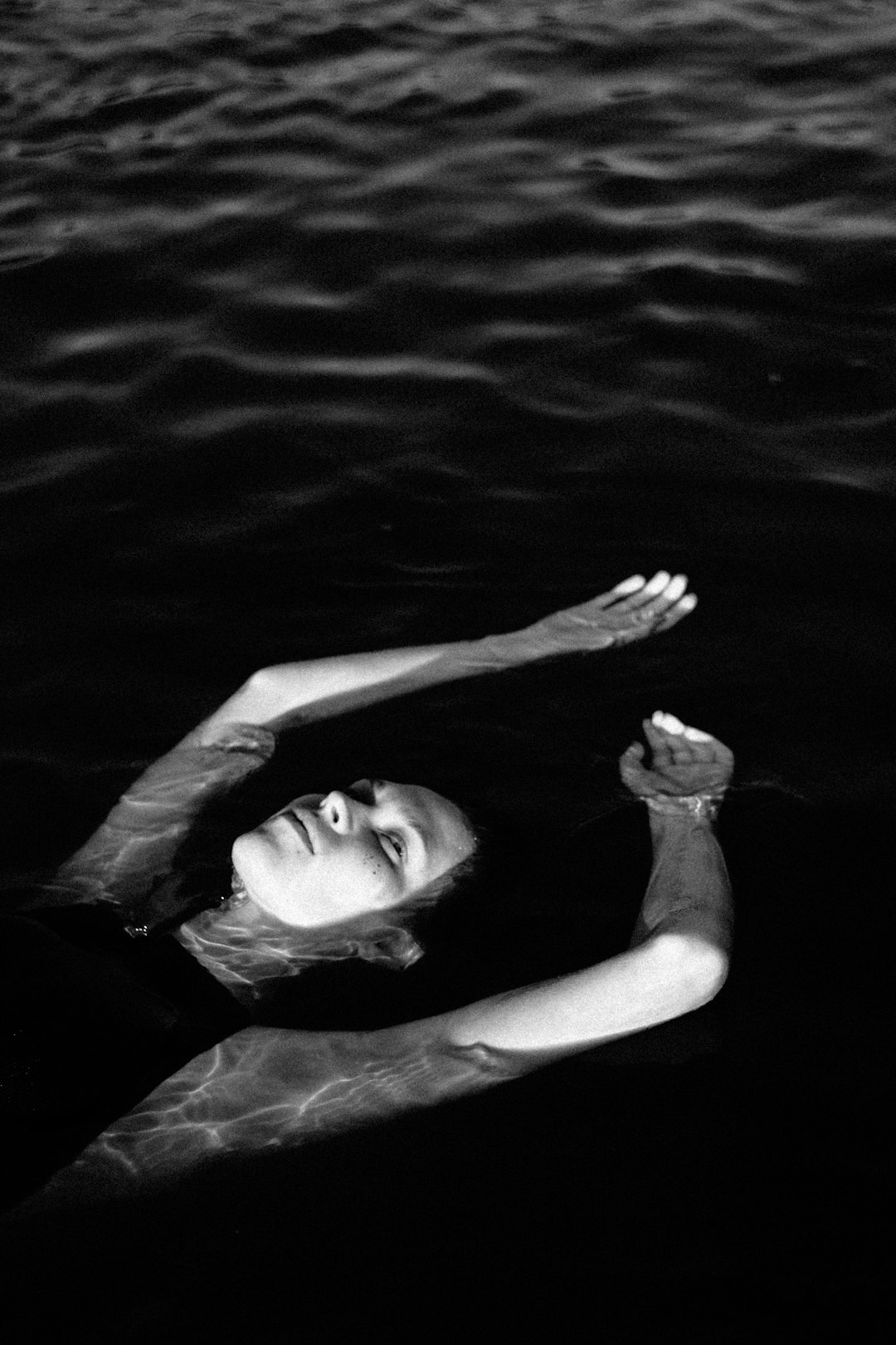 woman lying on the water