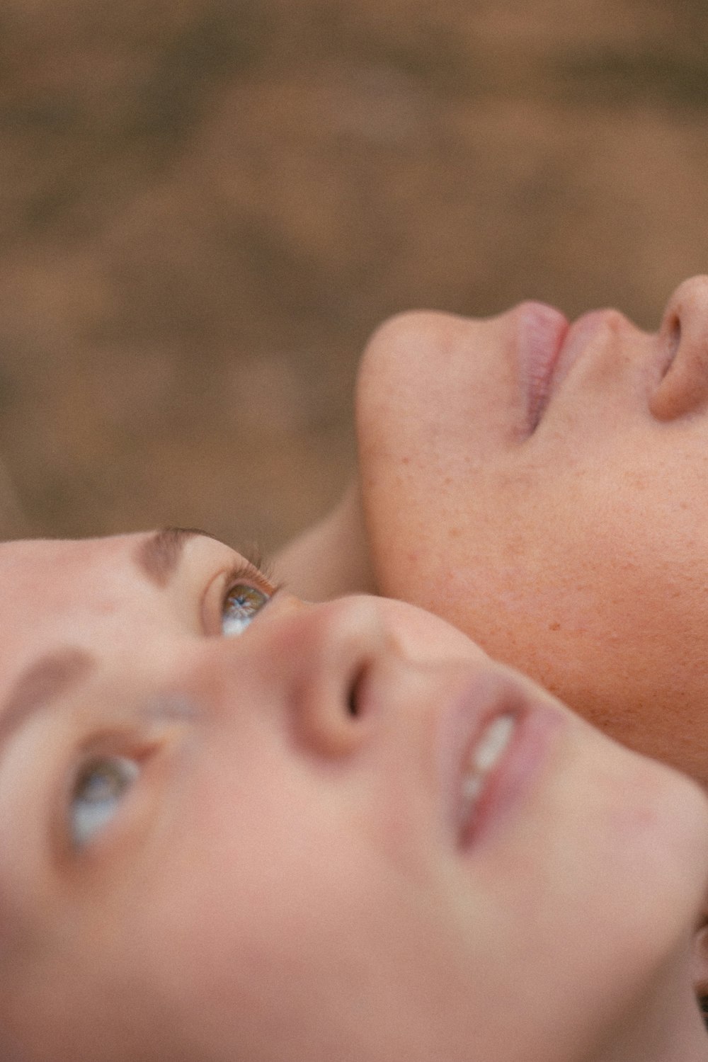 woman and child lying on ground