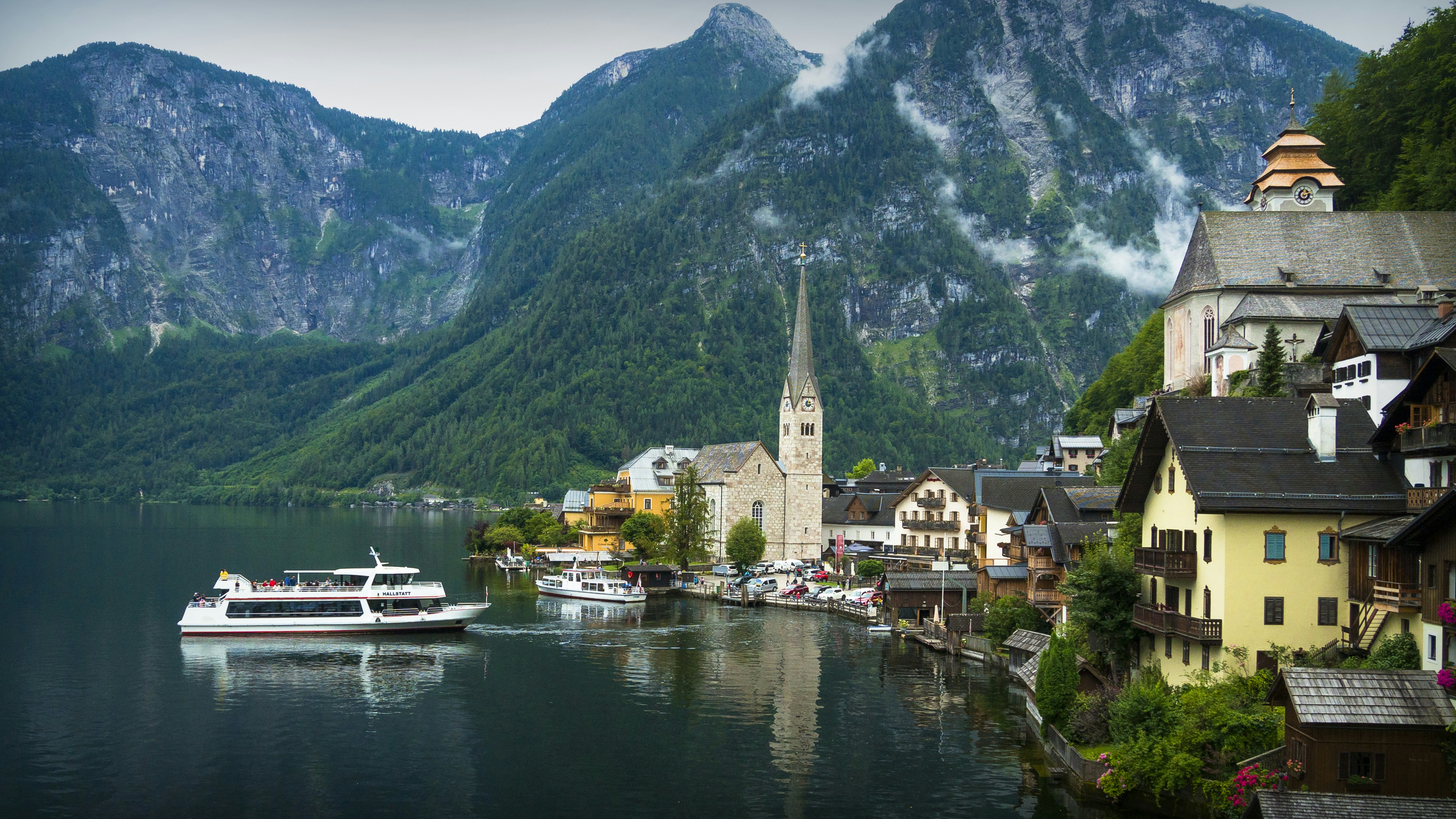 white boat on water near green mountain during daytime, Beautiful city Hallstatt, Austria