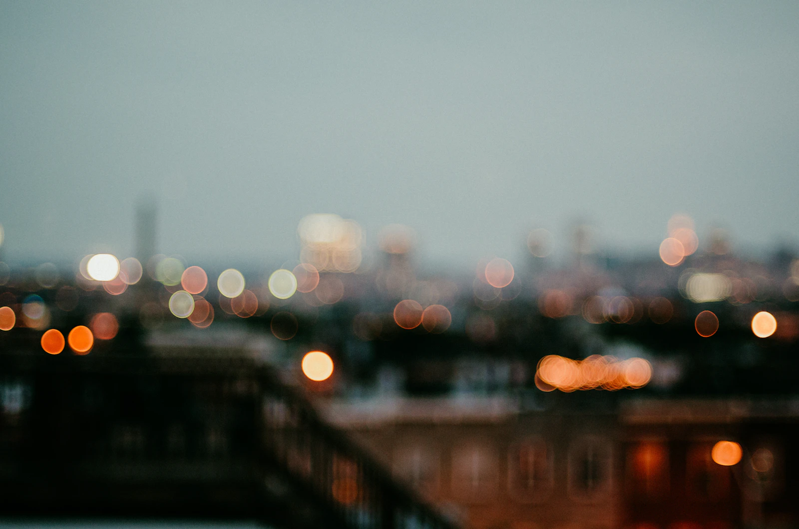 A city skyline at night from a hillside