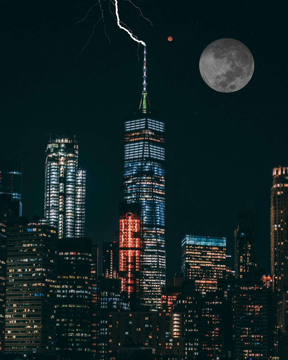 full moon over high rise buildings