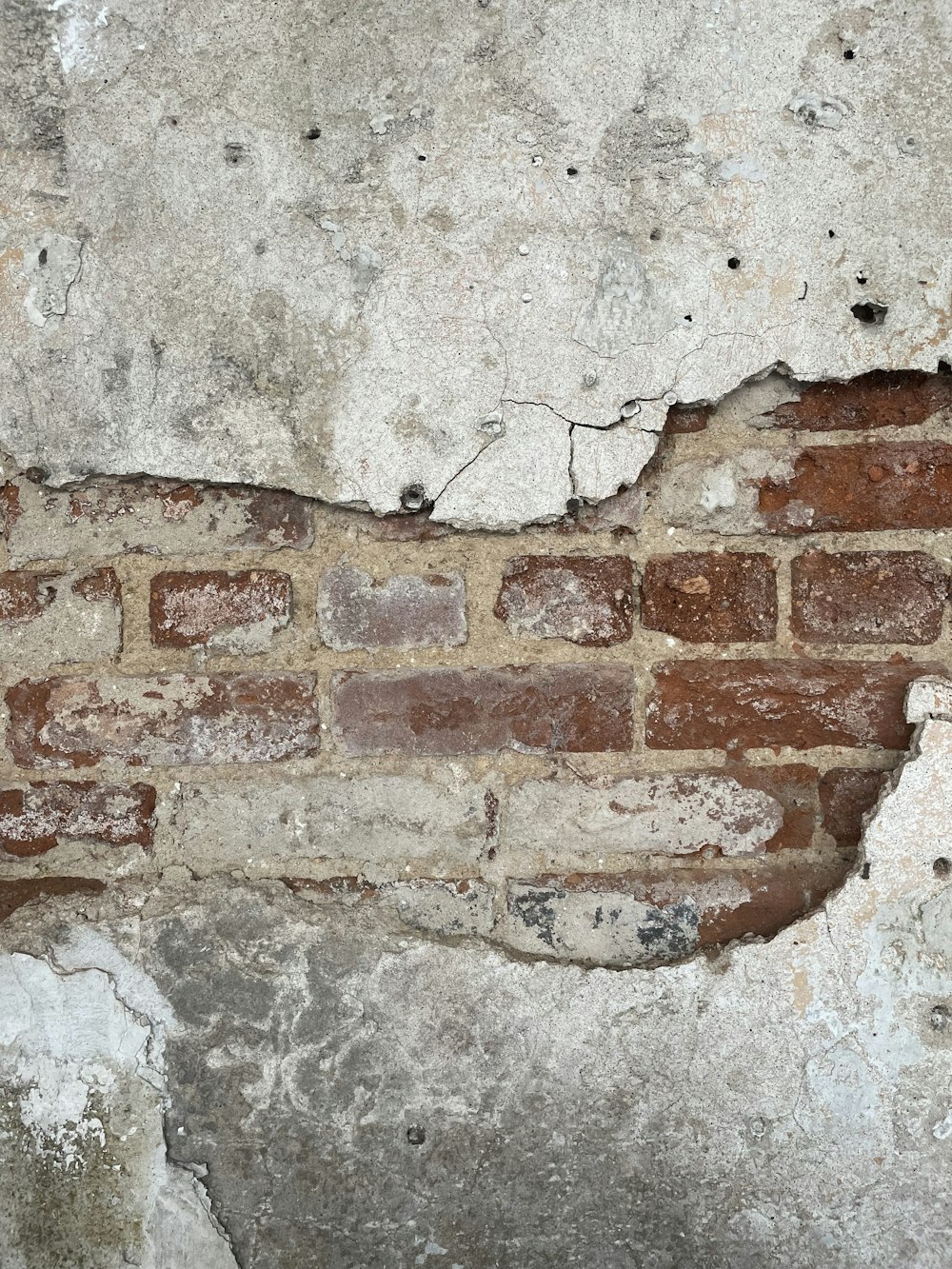 black coated wire on brown brick wall