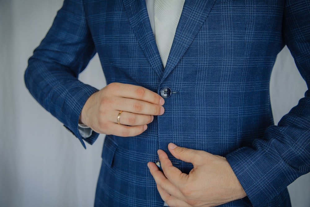 man in blue and white plaid button up long sleeve shirt