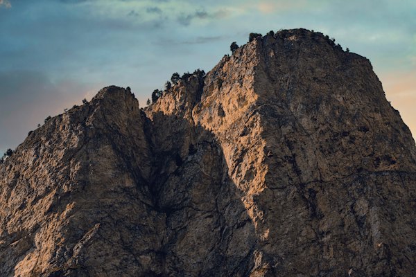 Brown rocky mountain under cloudy sky during daytime — Val Gardena, Italy