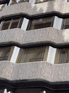 Close-up 3D rendering of architectural details such as balconies, windows, and textures on a building facade.