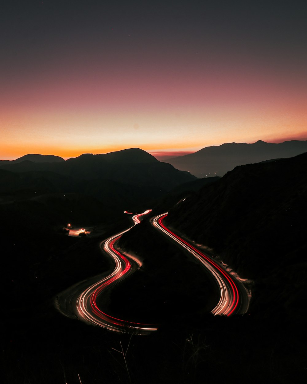 time lapse photography of cars on road during night time