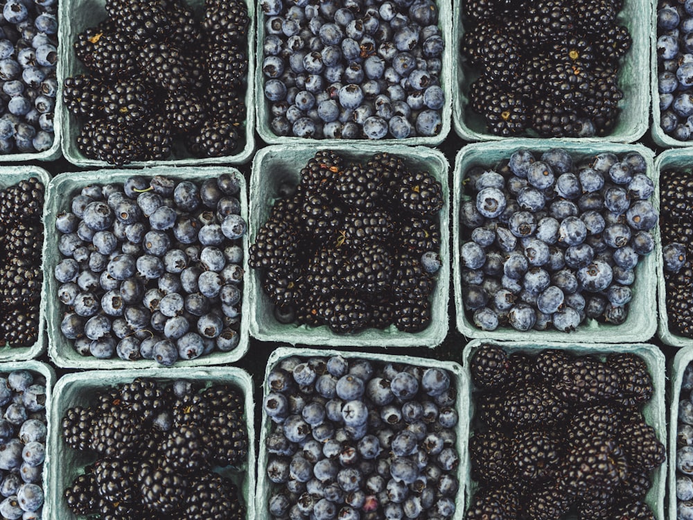 black berries on black surface