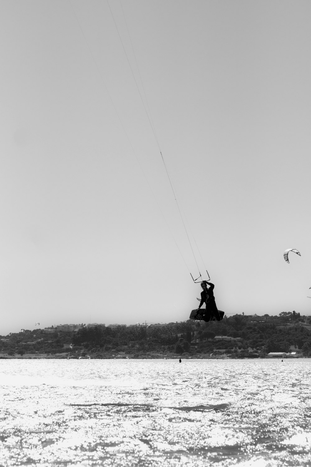 silhouette of person riding on a parachute