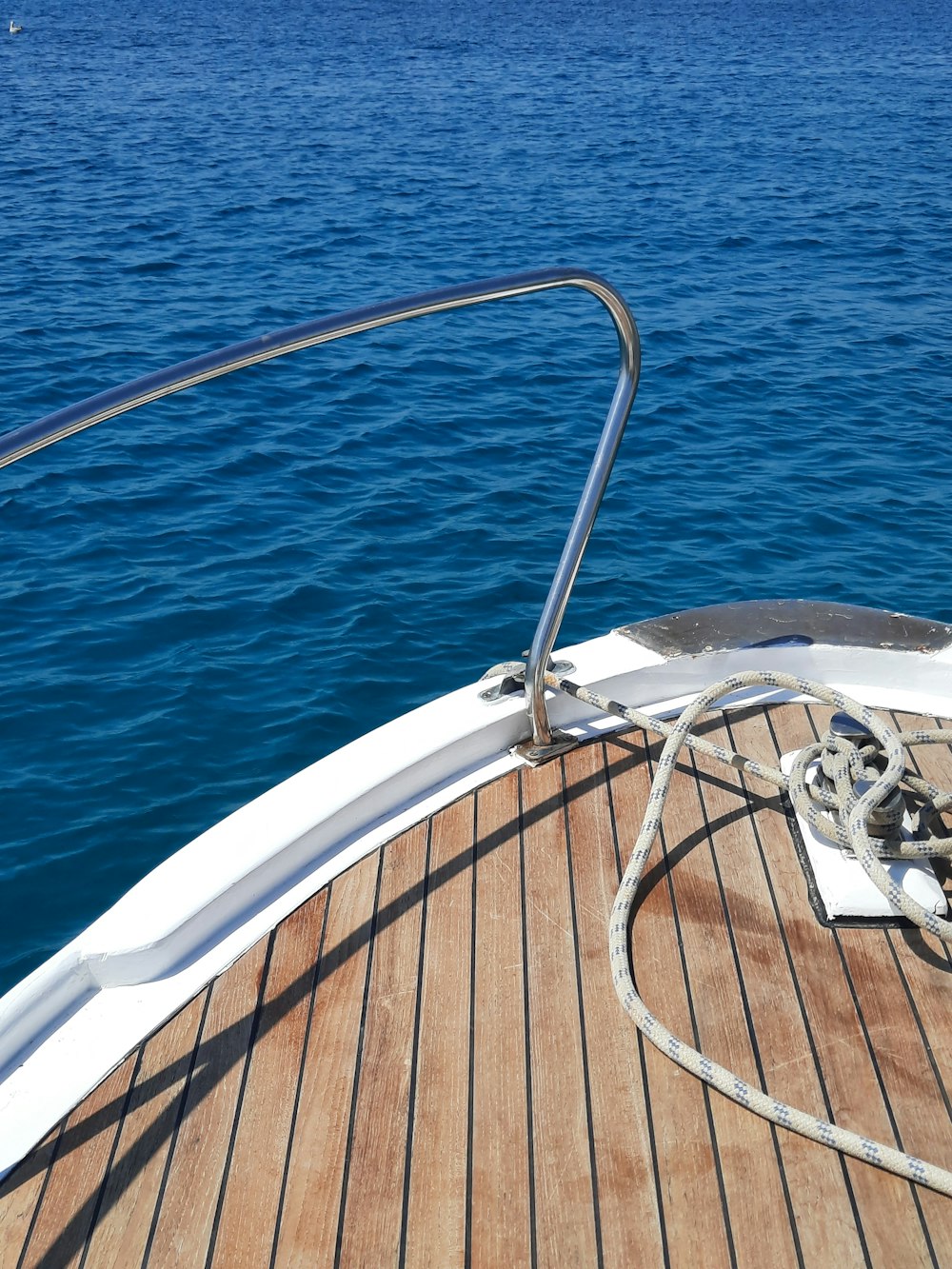 white and gray boat on blue sea during daytime