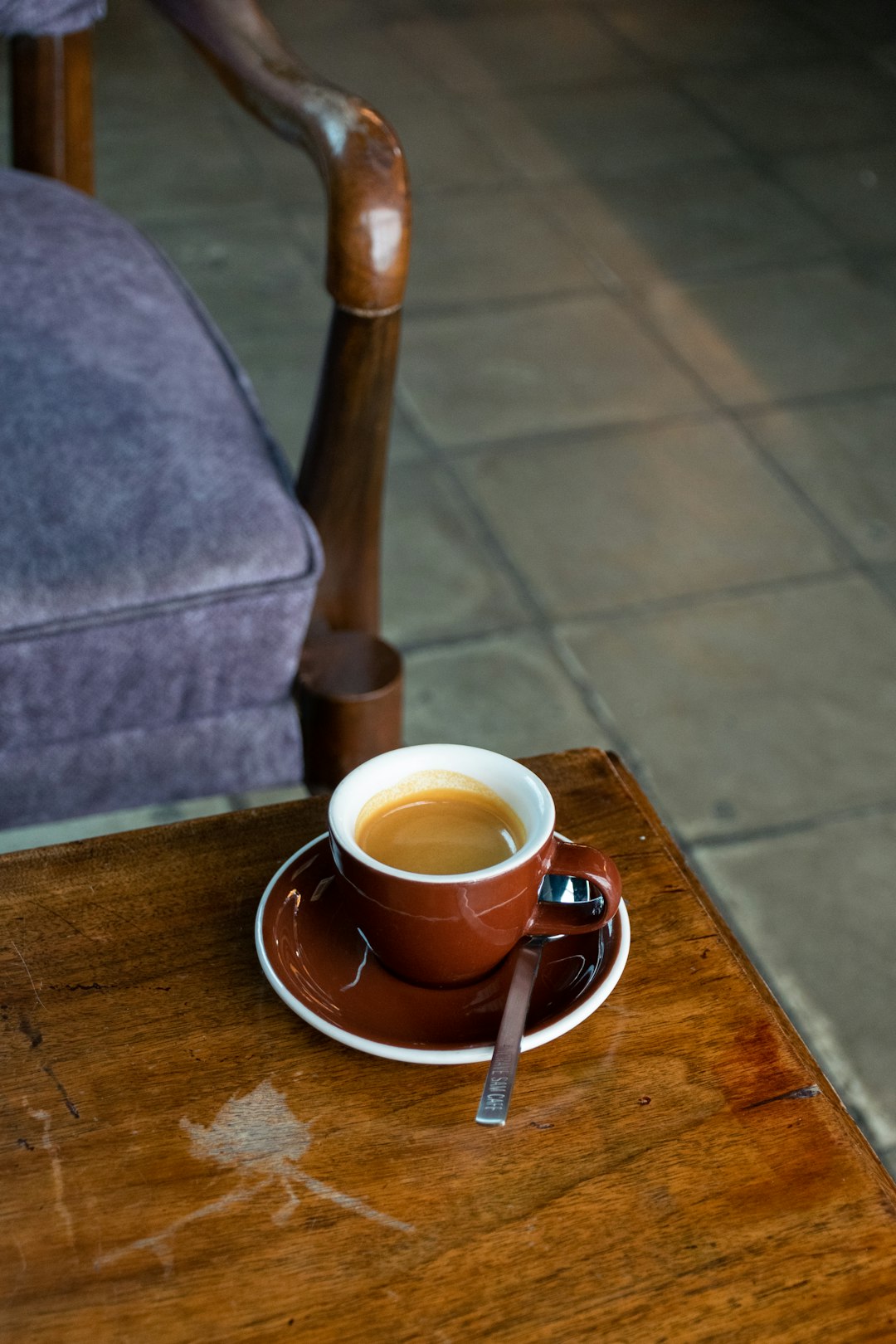 brown ceramic mug on brown wooden table