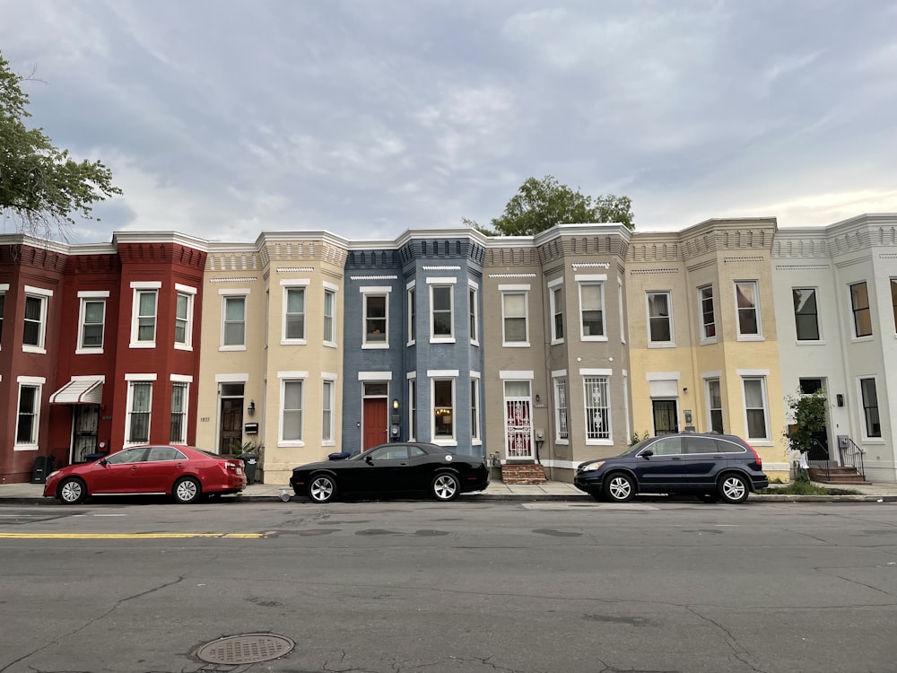 cars parked in front of building during daytime