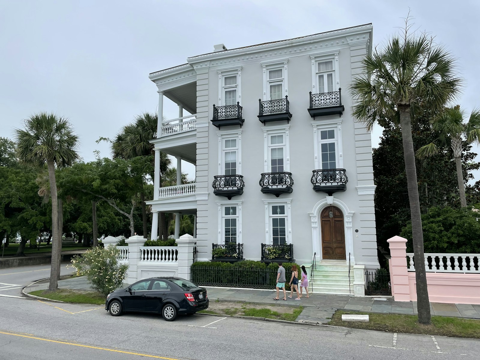 Historic Charleston single house with tiered piazza on a downtown street