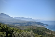 A panoramic view of the Samaná coastline with lush green hills meeting the sea.
