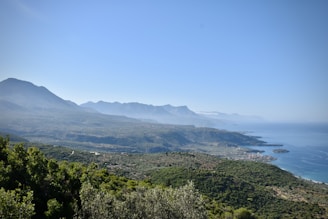 A panoramic view of the Samaná coastline with lush green hills meeting the sea.