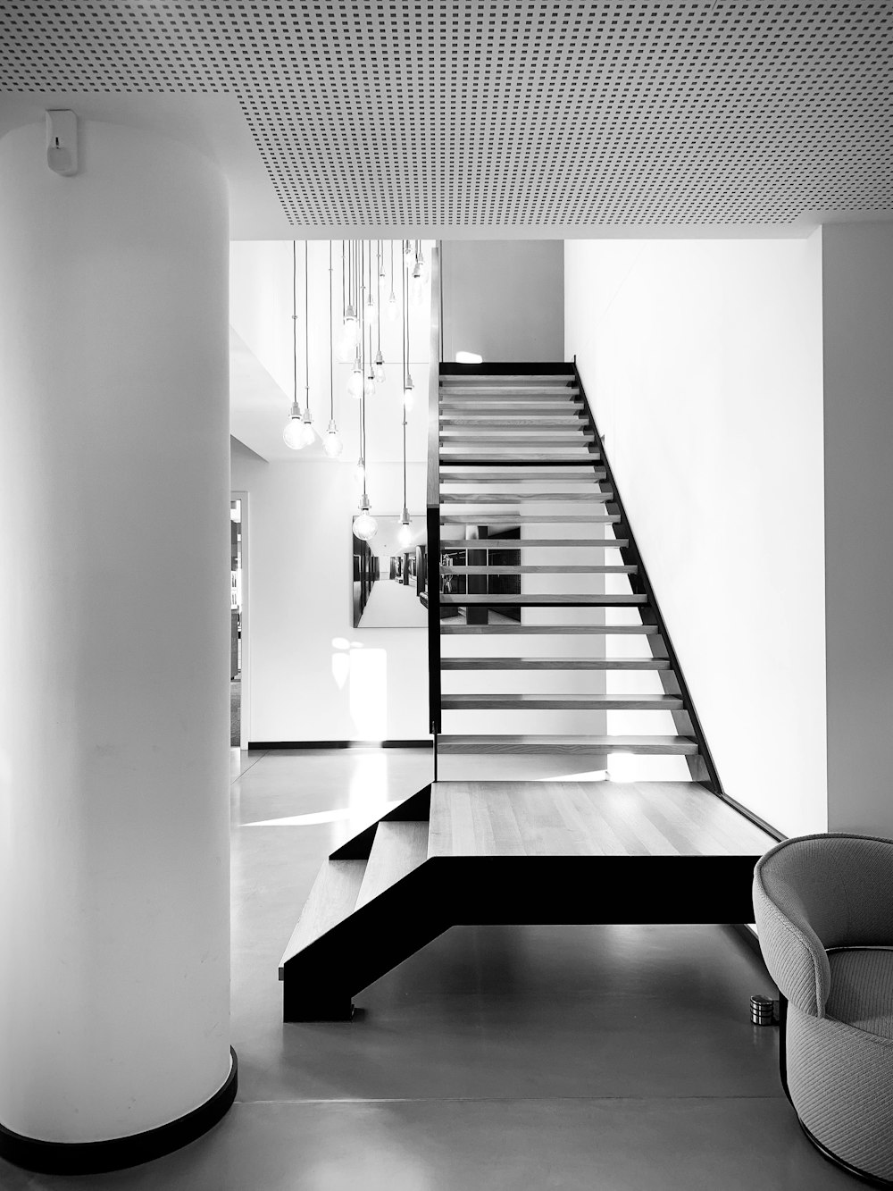 grayscale photo of staircase in building