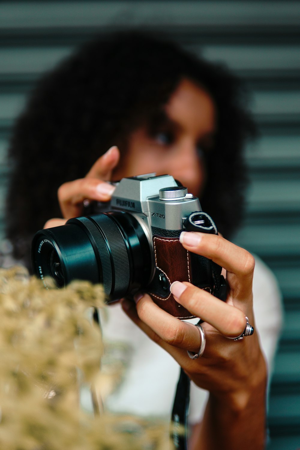 woman holding black and silver dslr camera