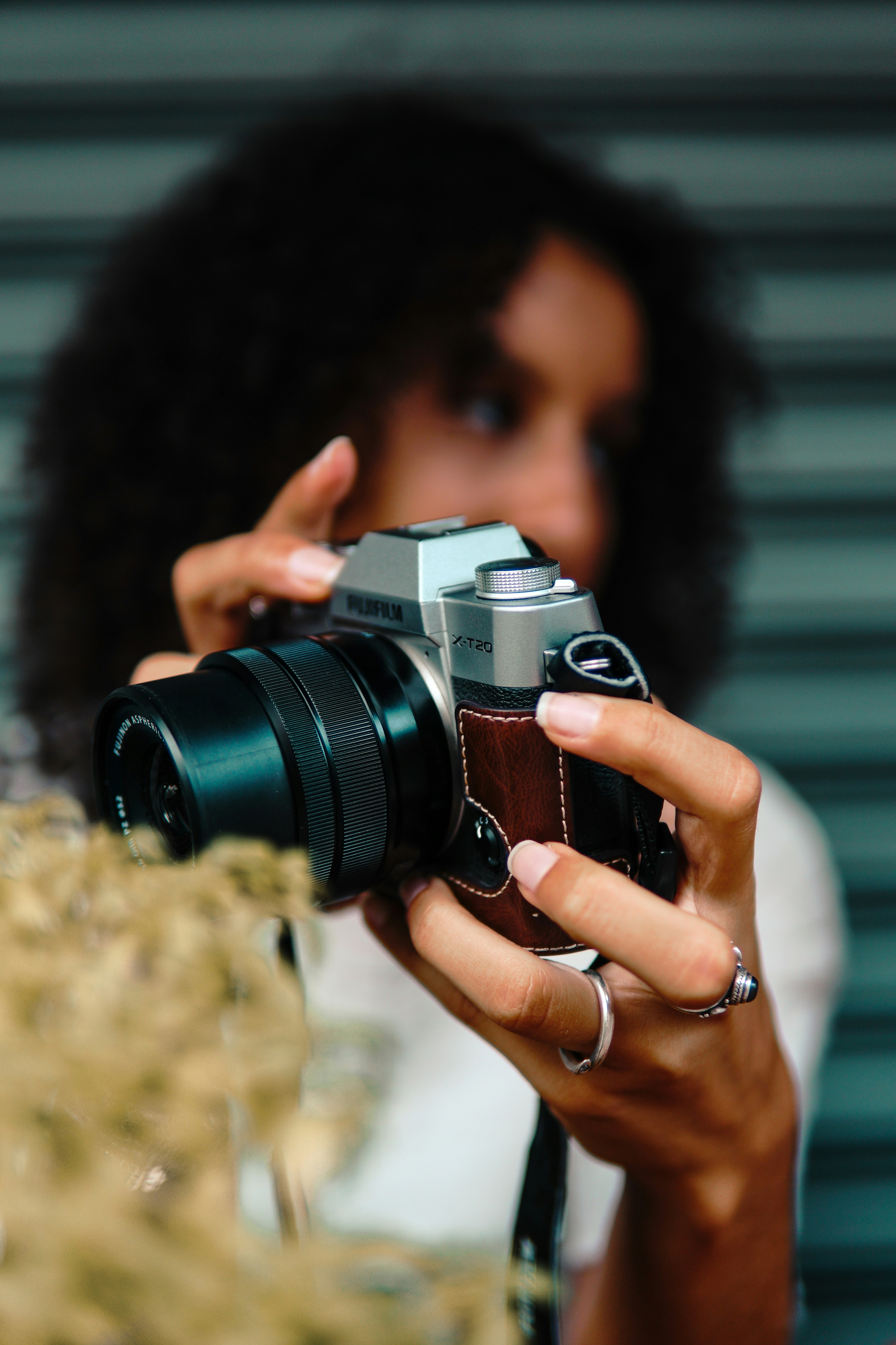 woman holding black and silver dslr camera