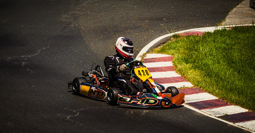 person riding on go kart