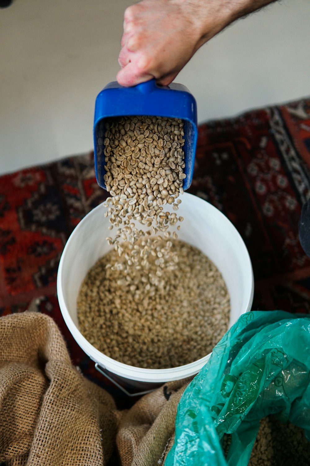 a person is pouring grain into a bowl