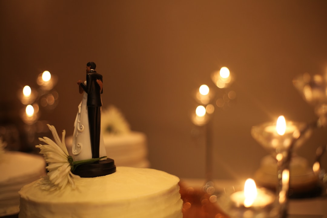 black and white ceramic figurine on white round cake