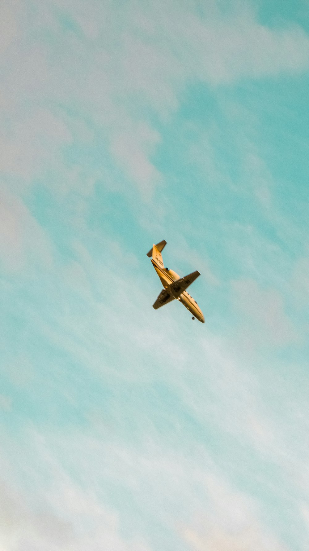 brown and black plane in mid air during daytime