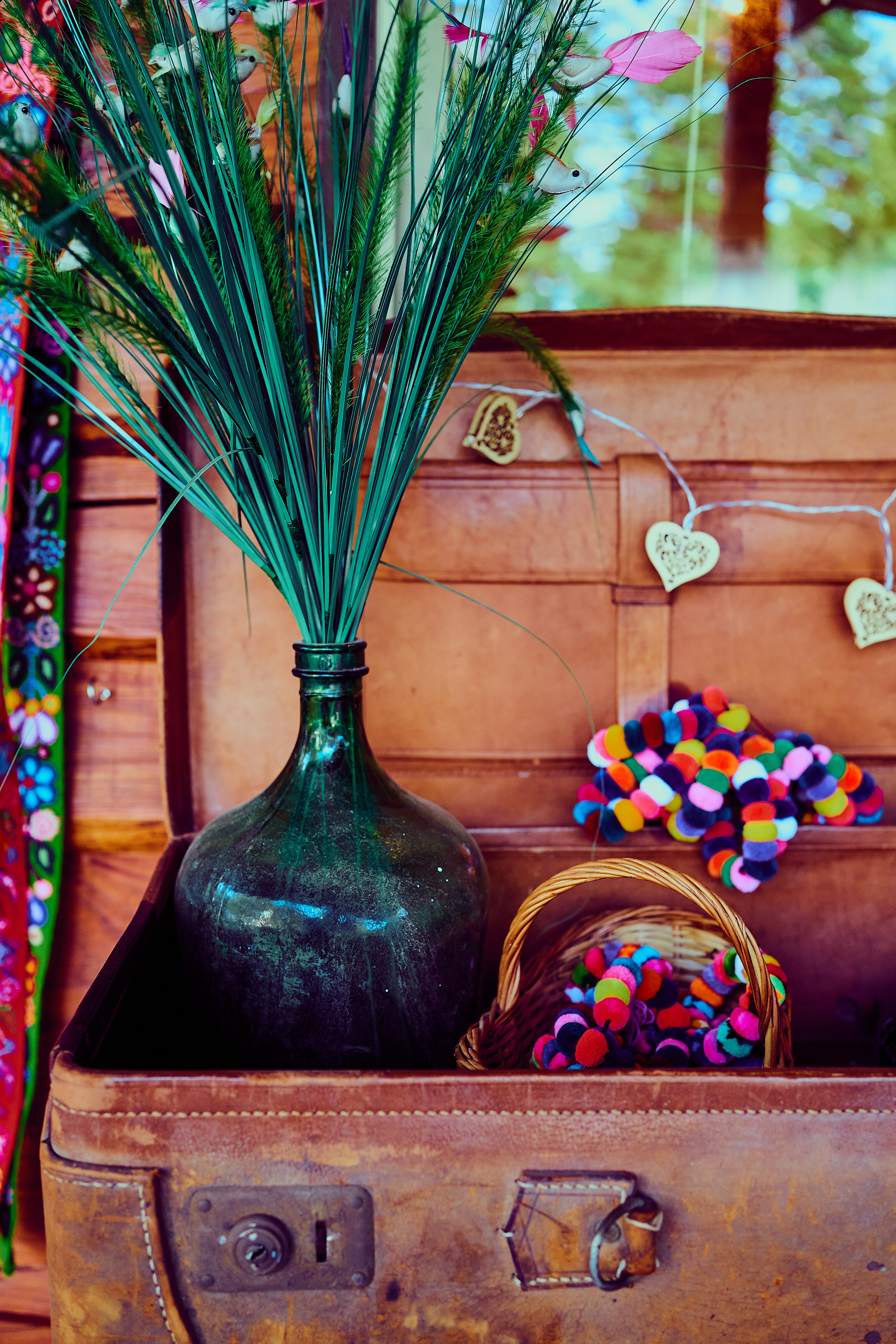 blue glass vase with flowers