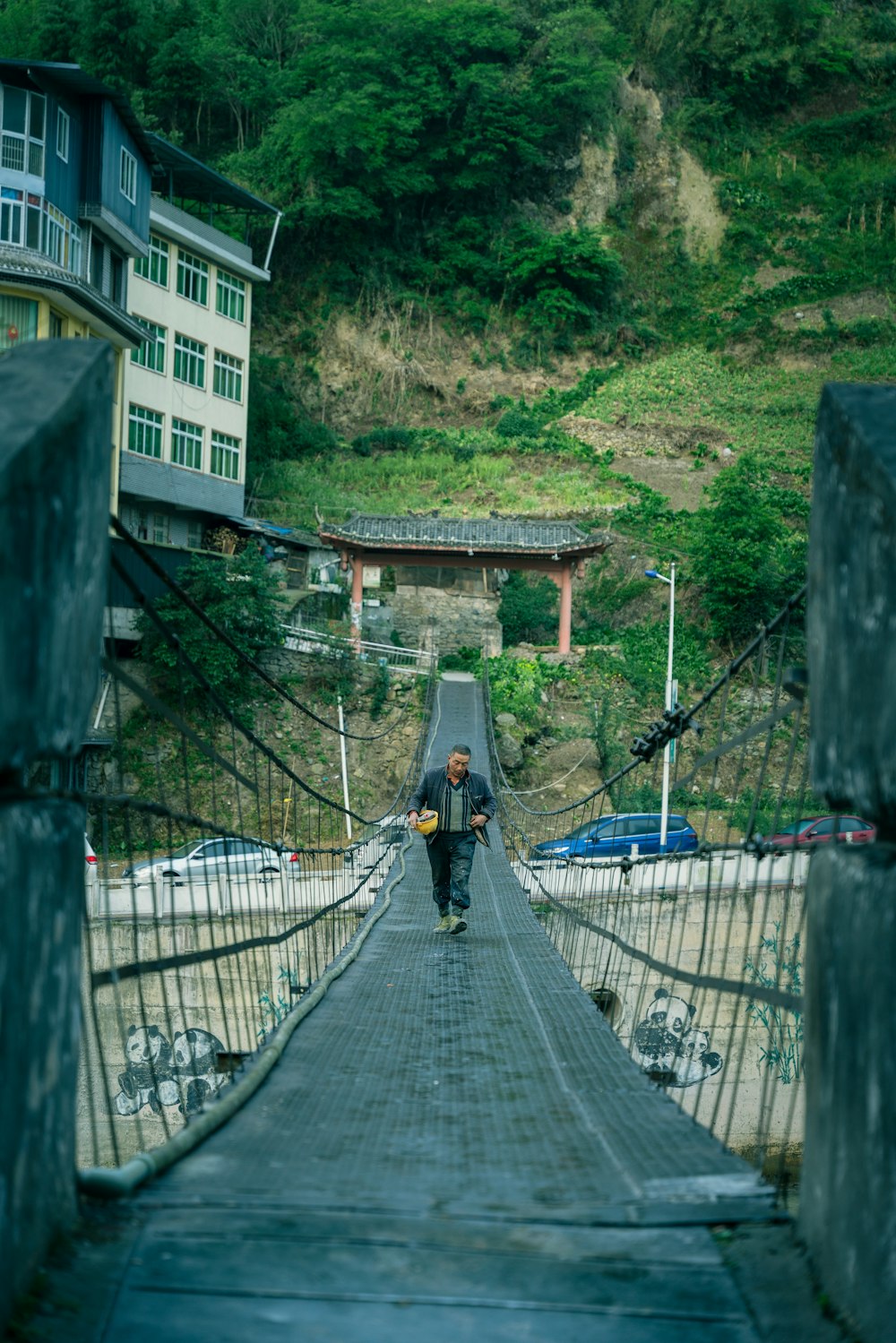 people walking on wooden bridge during daytime