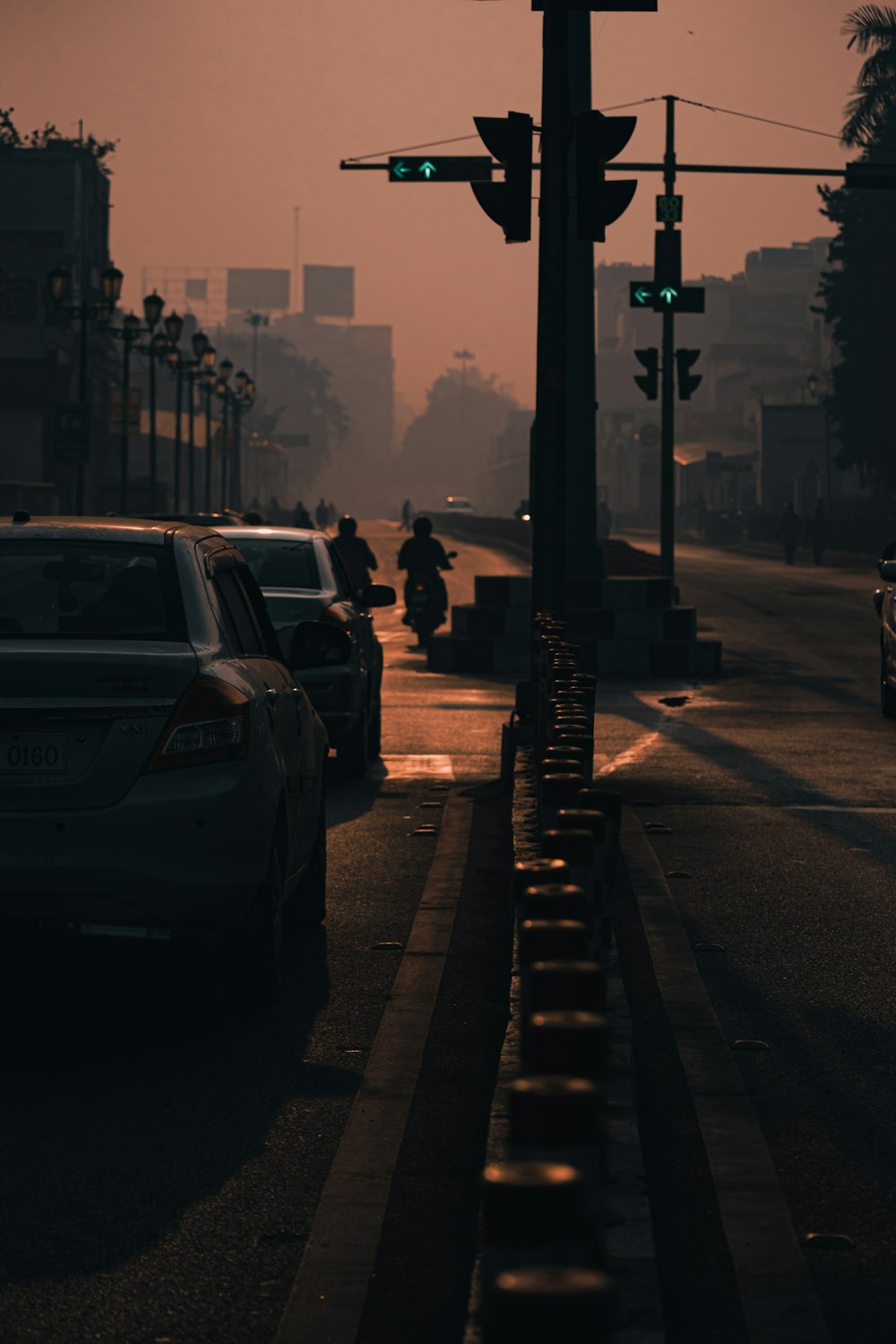 cars parked on sidewalk during daytime