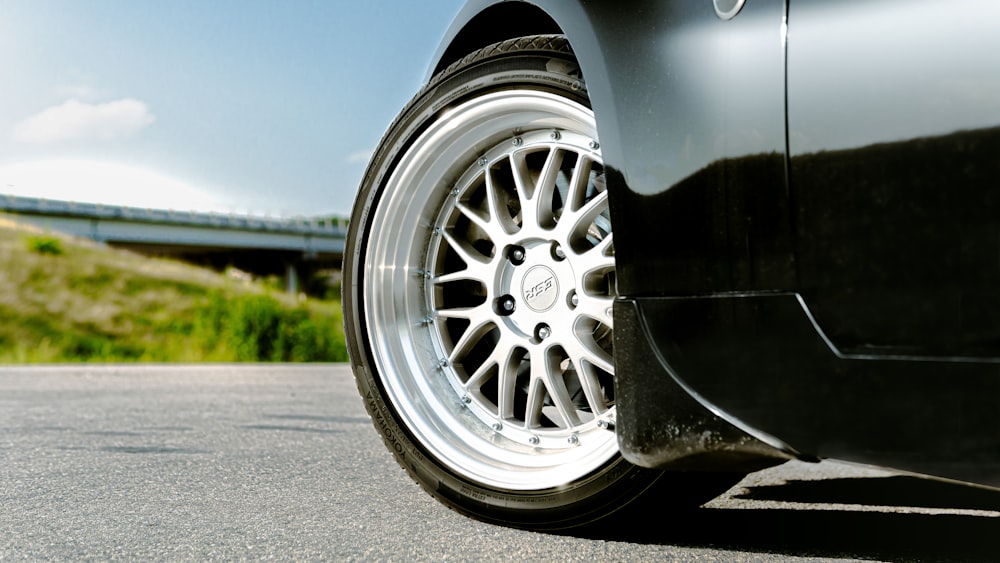 silver car wheel on road