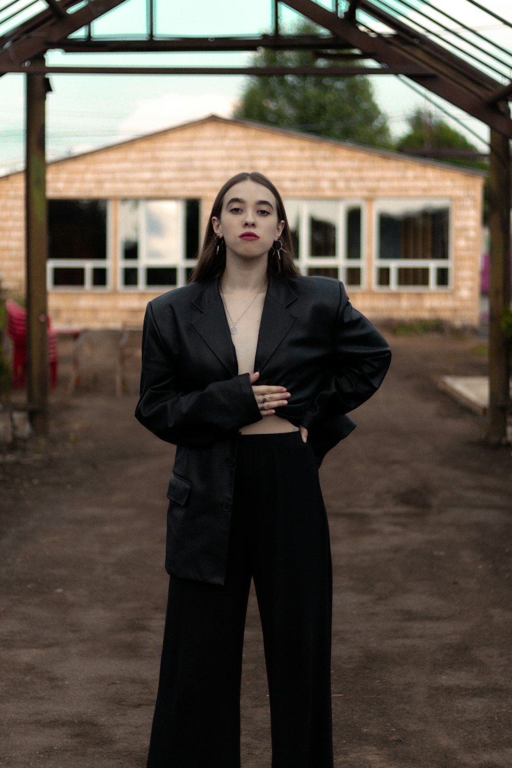 a woman standing in front of a building