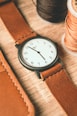 A watch with leather straps