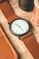 A watch with leather straps