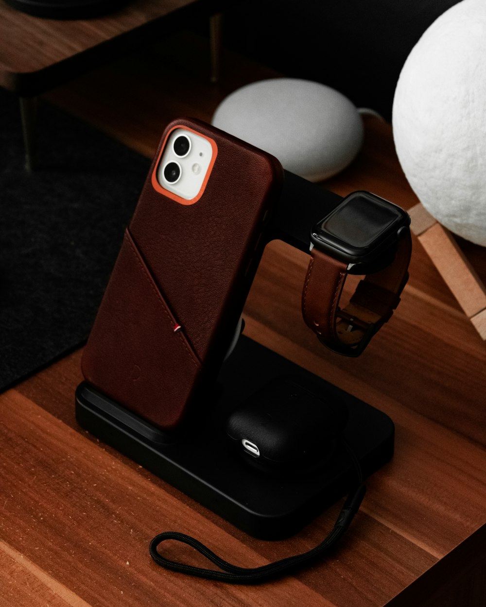 a cell phone sitting on top of a wooden table