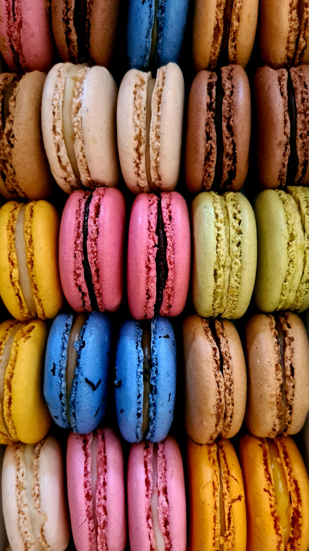 a box filled with lots of different colored macaroons