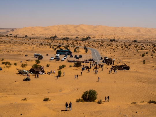 people on desert during daytime in Taghit Algeria