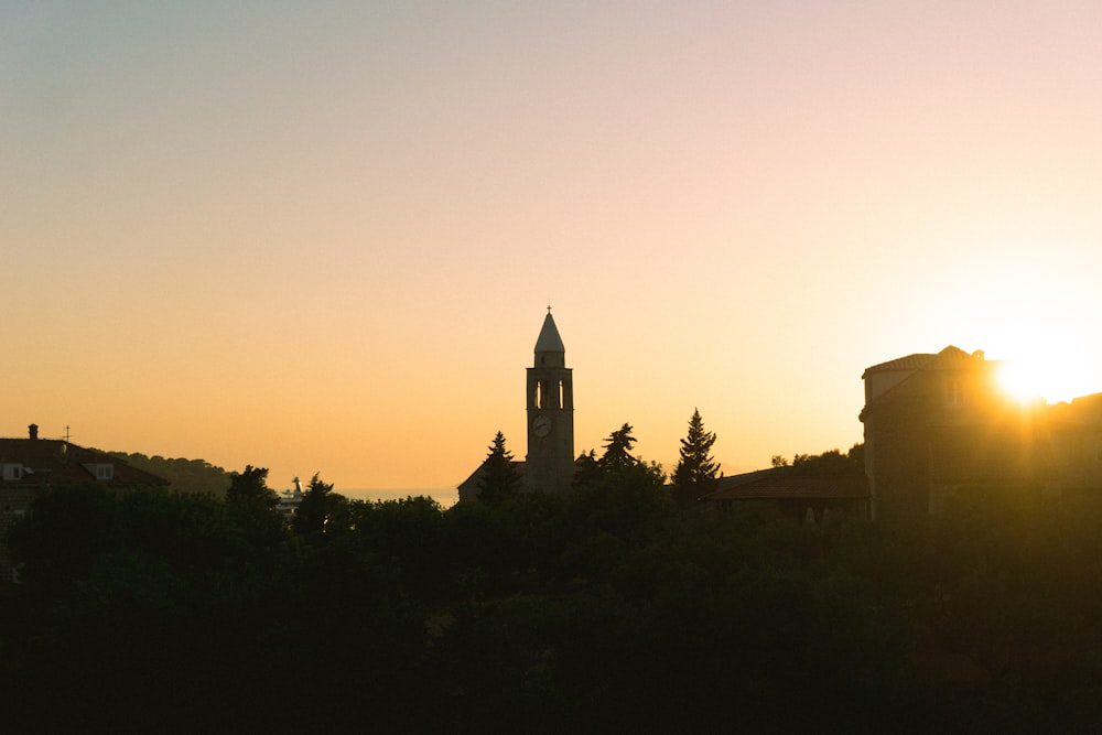 silhouette of building during sunset