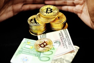 gold and silver coins on banknotes