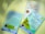 Three books are displayed against a light green background, with two partly facing up and exhibiting colorful covers. The book titled 'Aku Muslim tapi Belum Shalat' has a light blue cover featuring an illustration of a mosque and green hills, accompanied by Islamic-themed text. Another book is titled 'Tata Cara Shalat Menurut Sunnah Nabi' with a white cover and gold and brown text. The third book is shown from the back, featuring a photograph of a man and text describing the content.