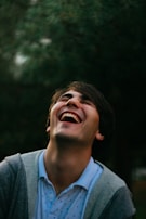 A candid shot of a celebrity laughing during an interview.