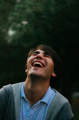 Energetic team member captured mid-laugh in a candid moment.