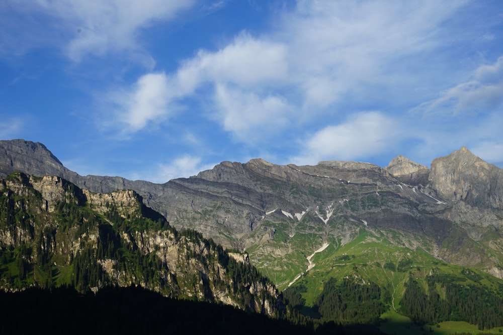 green and brown mountain under blue sky during daytime