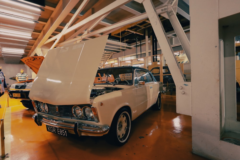white classic car in a garage