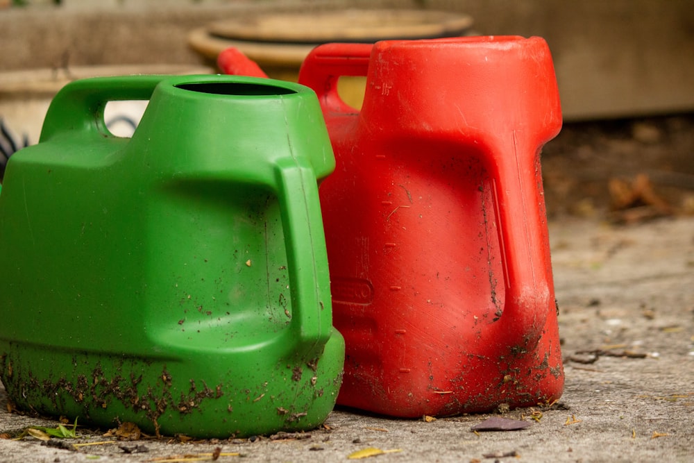 2 red and green plastic chairs on gray concrete floor