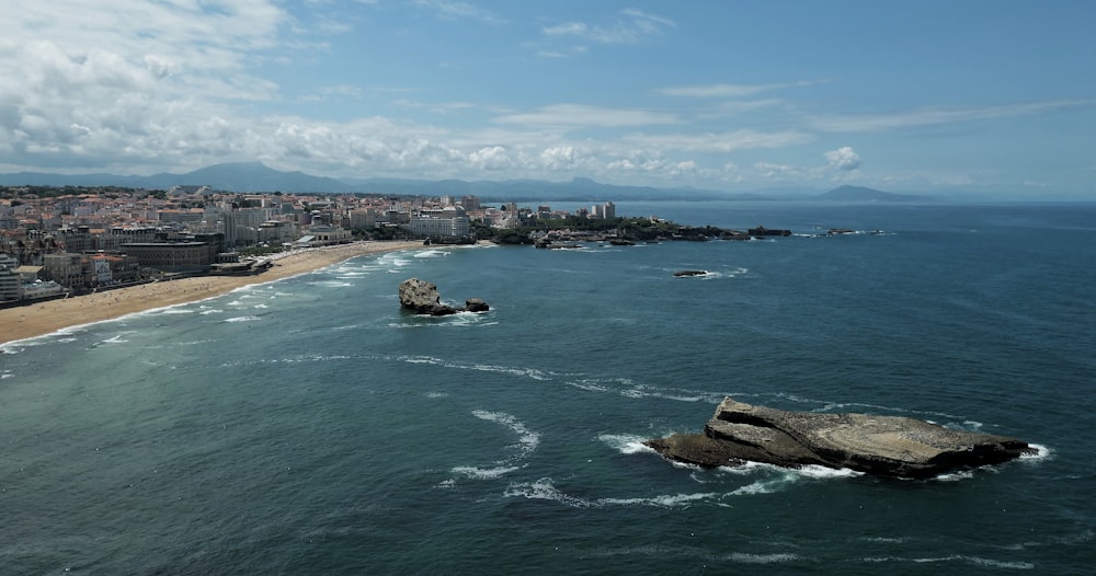 aerial view of city near body of water during daytime