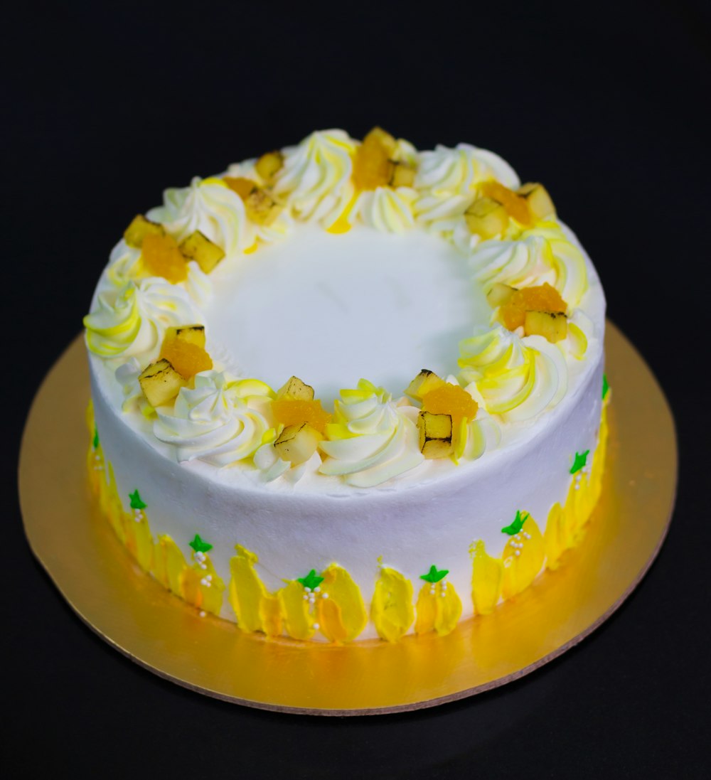 yellow and white cake on black surface